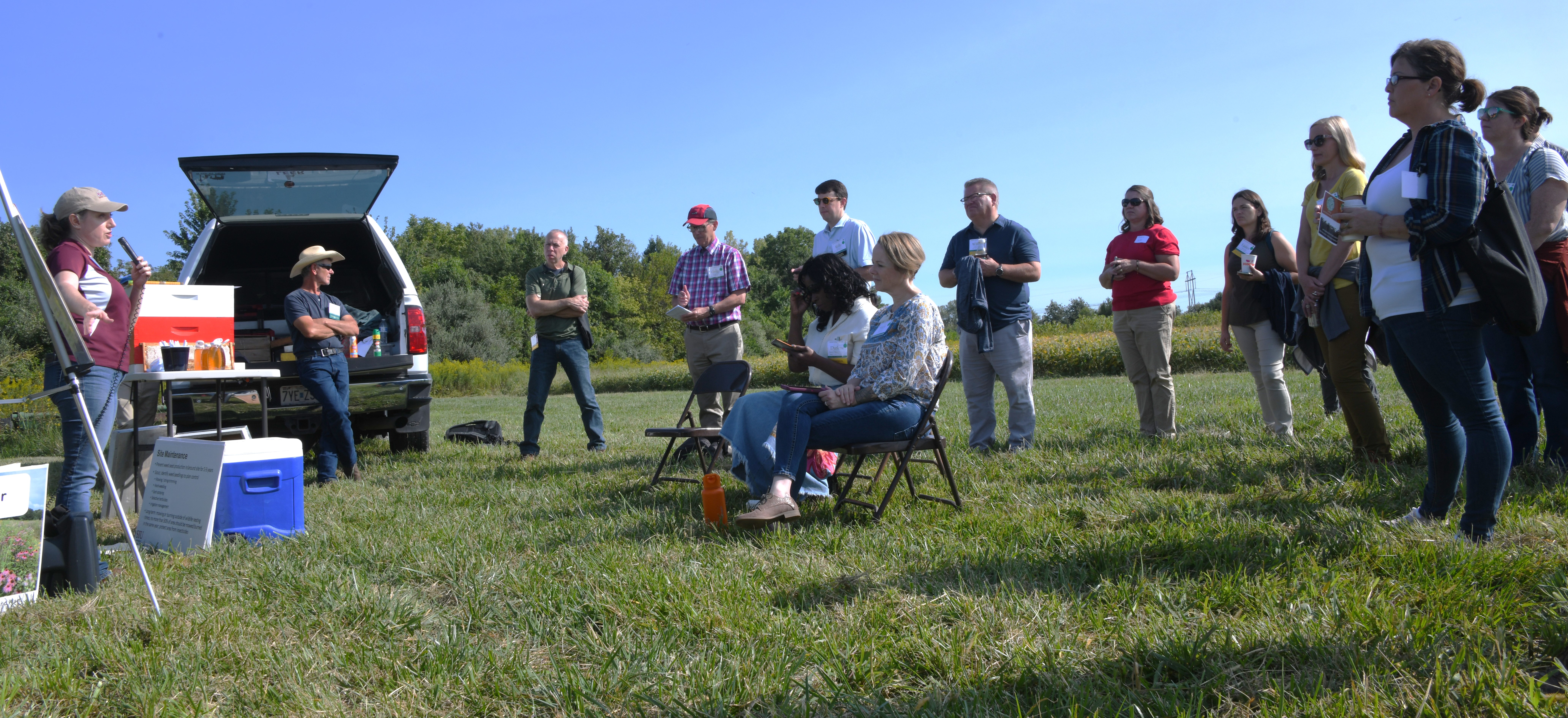 2022 Conservation in Action Tour MO (7) 2 Crowd in a field listening to speaker